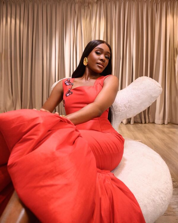 Ifeoma Nwobu stuns in Mesmerizing Red Canna Midi dress by Desiree Iyama